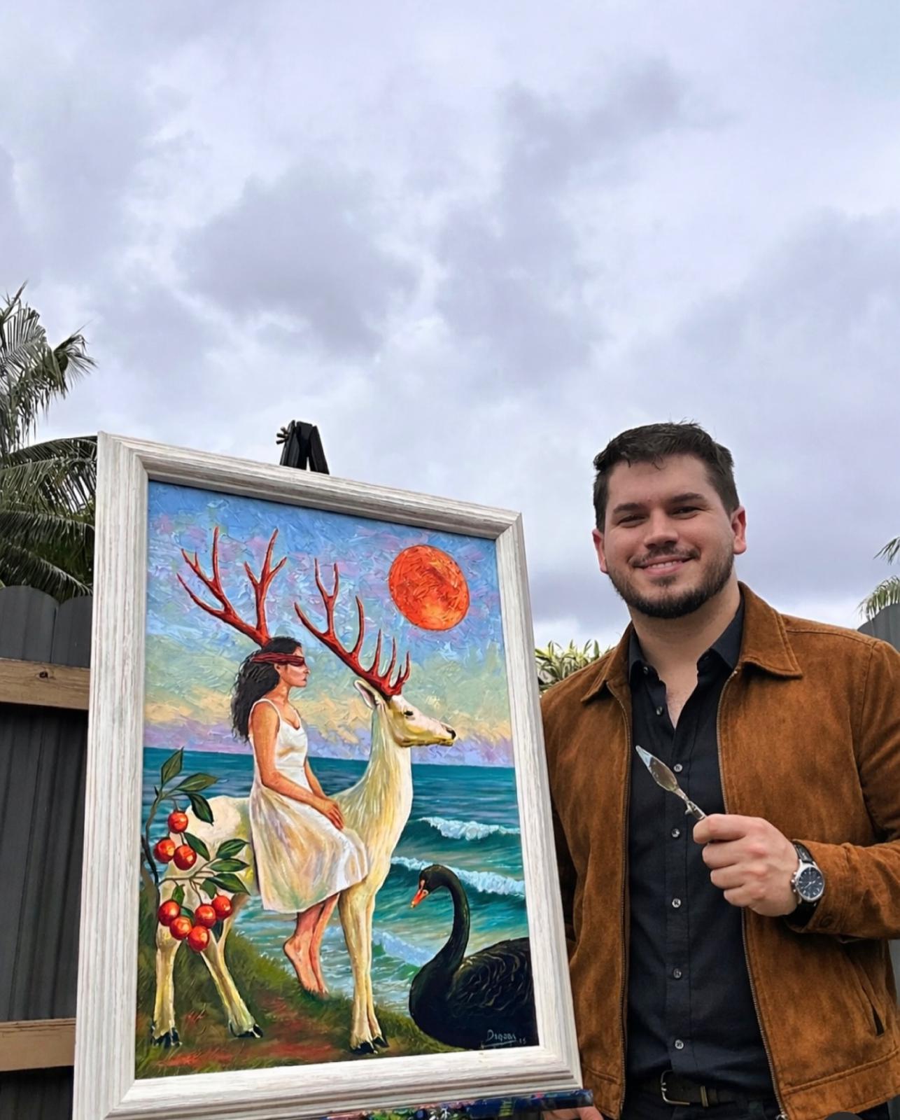 DAGOGA junto a una obra enmarcada